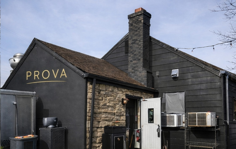 PROVA exterior with stone and charcoal siding